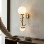Modern Gold Deer Head Wall Sconce with Frosted White Glass Globe - Image 2